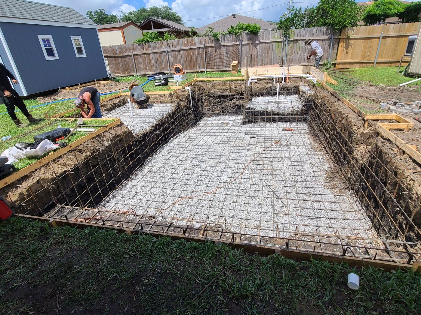 Step 4 of 14, Steel & plumbing: Steel rebar and plumbing lines going in.