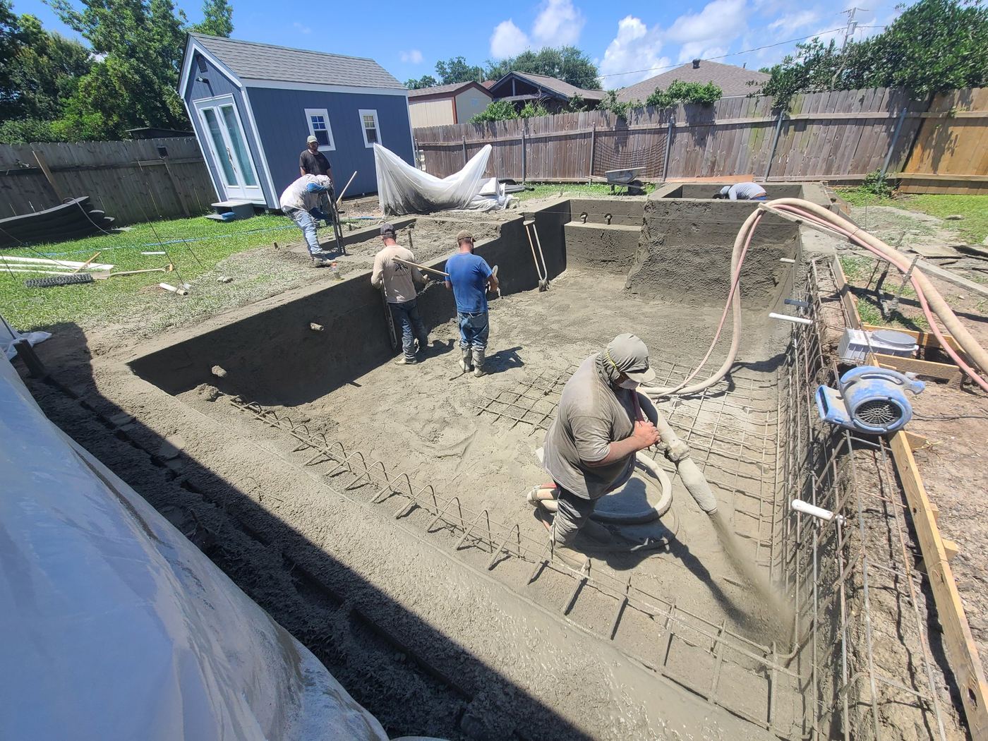 Step 5 of 14, Gunite: Gunite sprayed over the steel to form the shell.